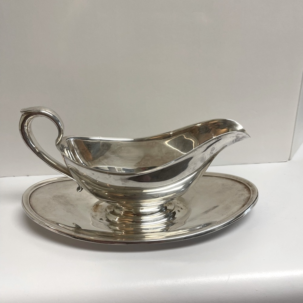 Gorham silver plate single piece gravy boat and under plate.